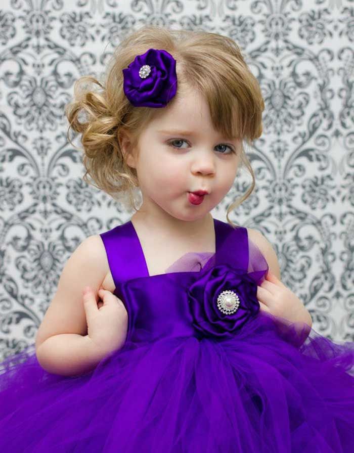 Cute Baby Girl In Purple Dress
