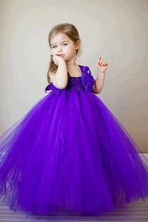 Cute Baby Girl In Purple Dress