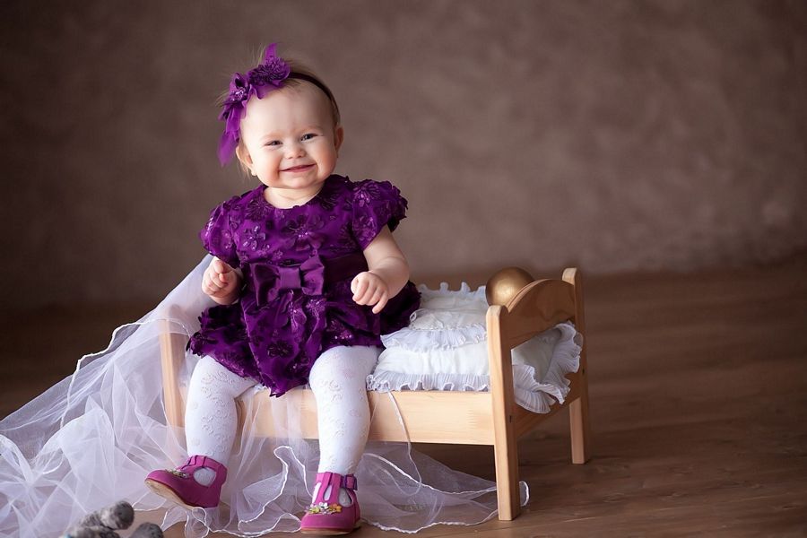 Cute Baby Girl In Purple Dress