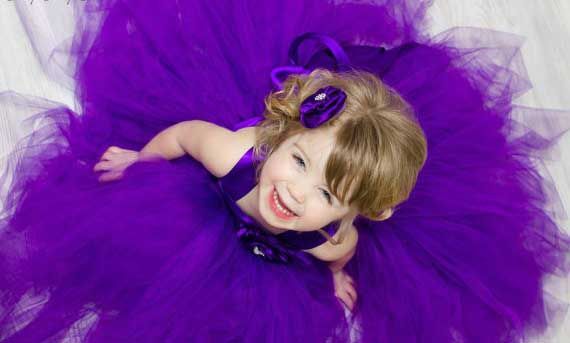 Cute Baby Girl In Purple Dress