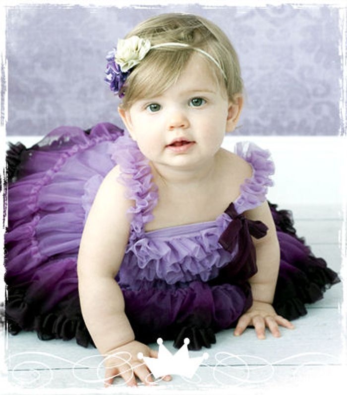 Cute Baby Girl In Purple Dress