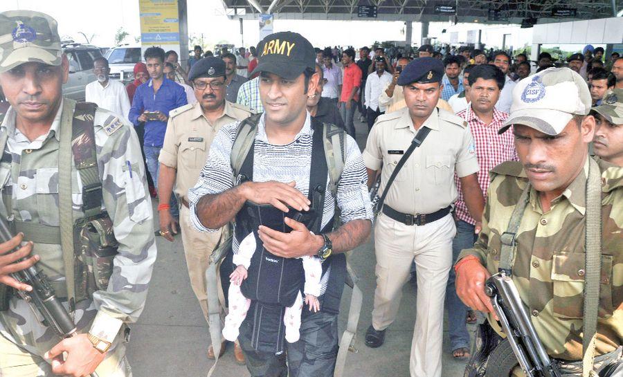 Dhoni with his daughter Ziva Photos