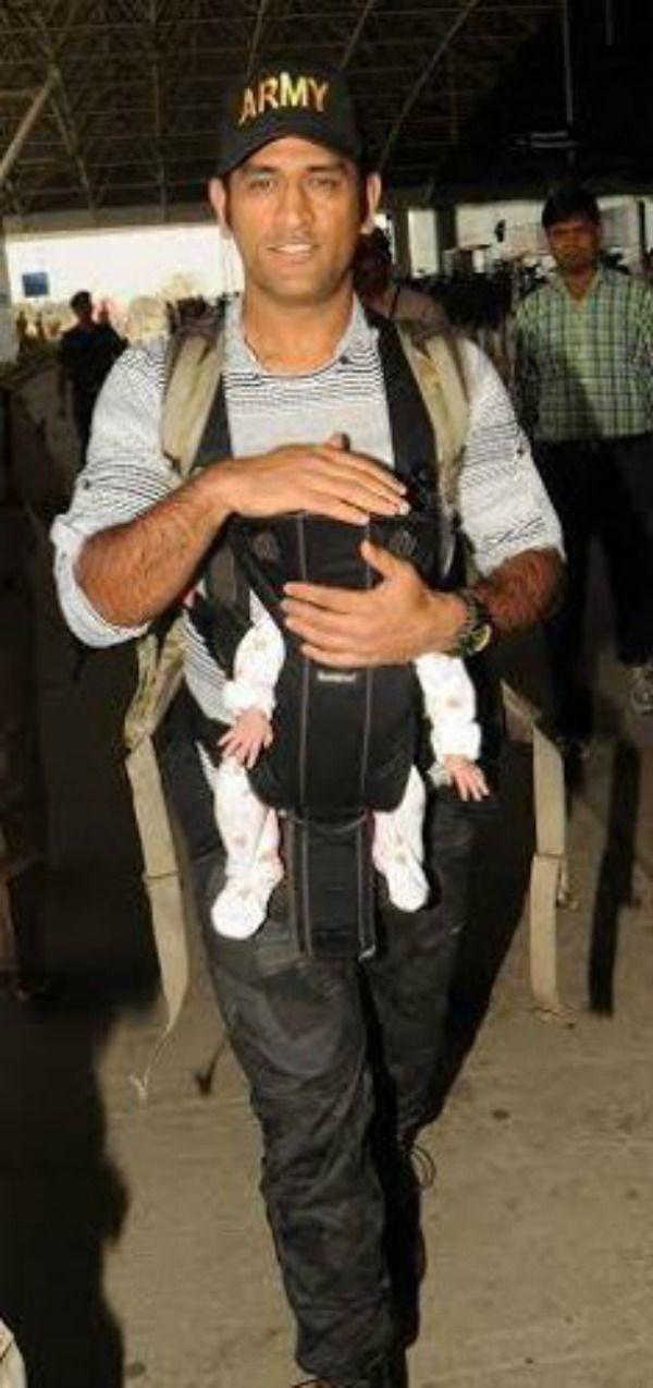 Dhoni with his daughter Ziva Photos