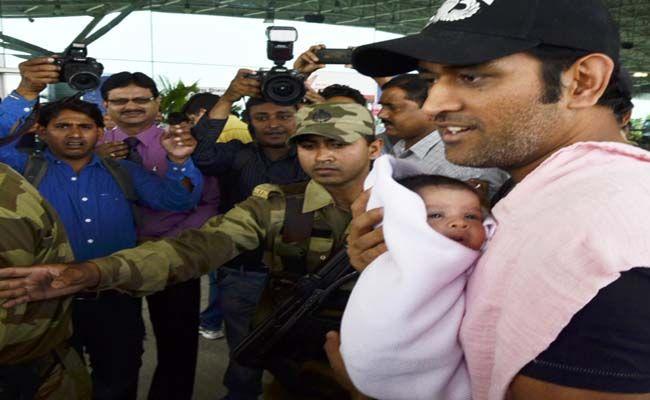 Dhoni with his daughter Ziva Photos