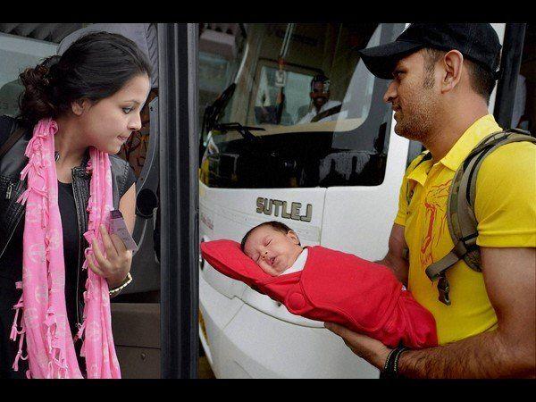 Dhoni with his daughter Ziva Photos