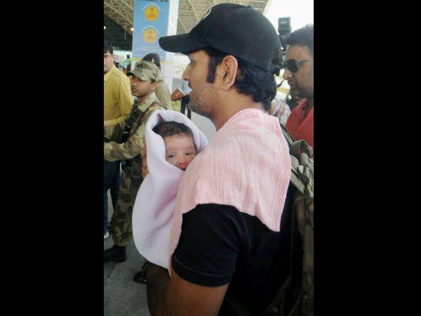 Dhoni with his daughter Ziva Photos