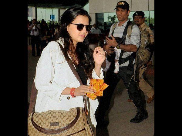 Dhoni with his daughter Ziva Photos