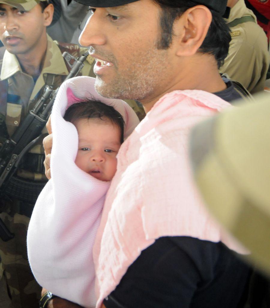 Dhoni with his daughter Ziva Photos