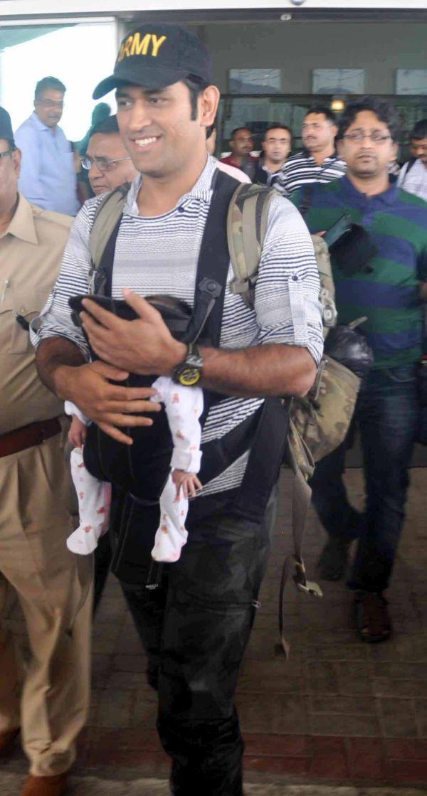 Dhoni with his daughter Ziva Photos