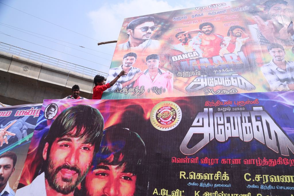 Fans Hungama At Anegan Theaters Photos