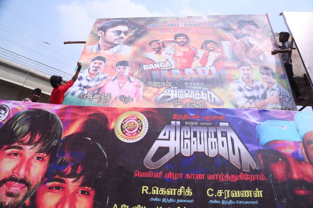 Fans Hungama At Anegan Theaters Photos