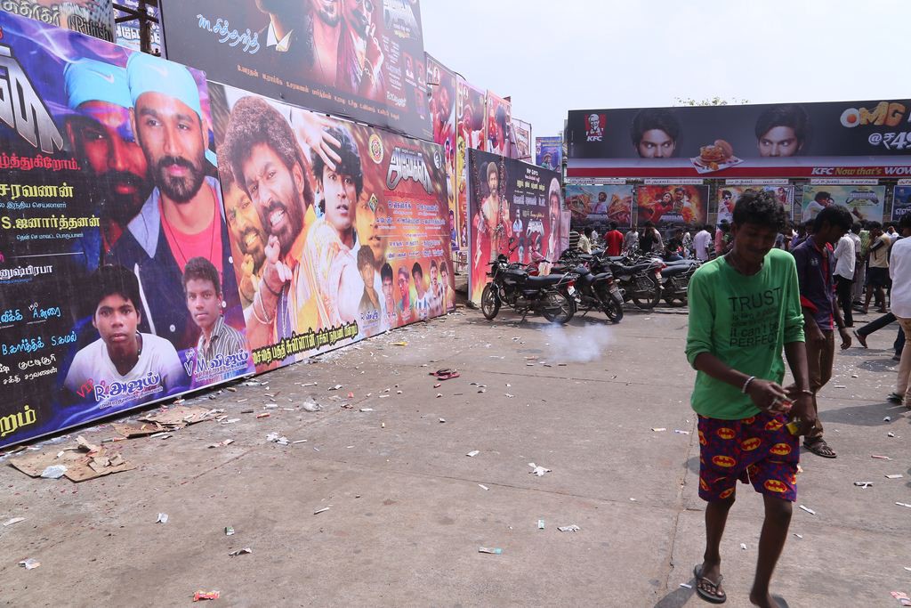 Fans Hungama At Anegan Theaters Photos