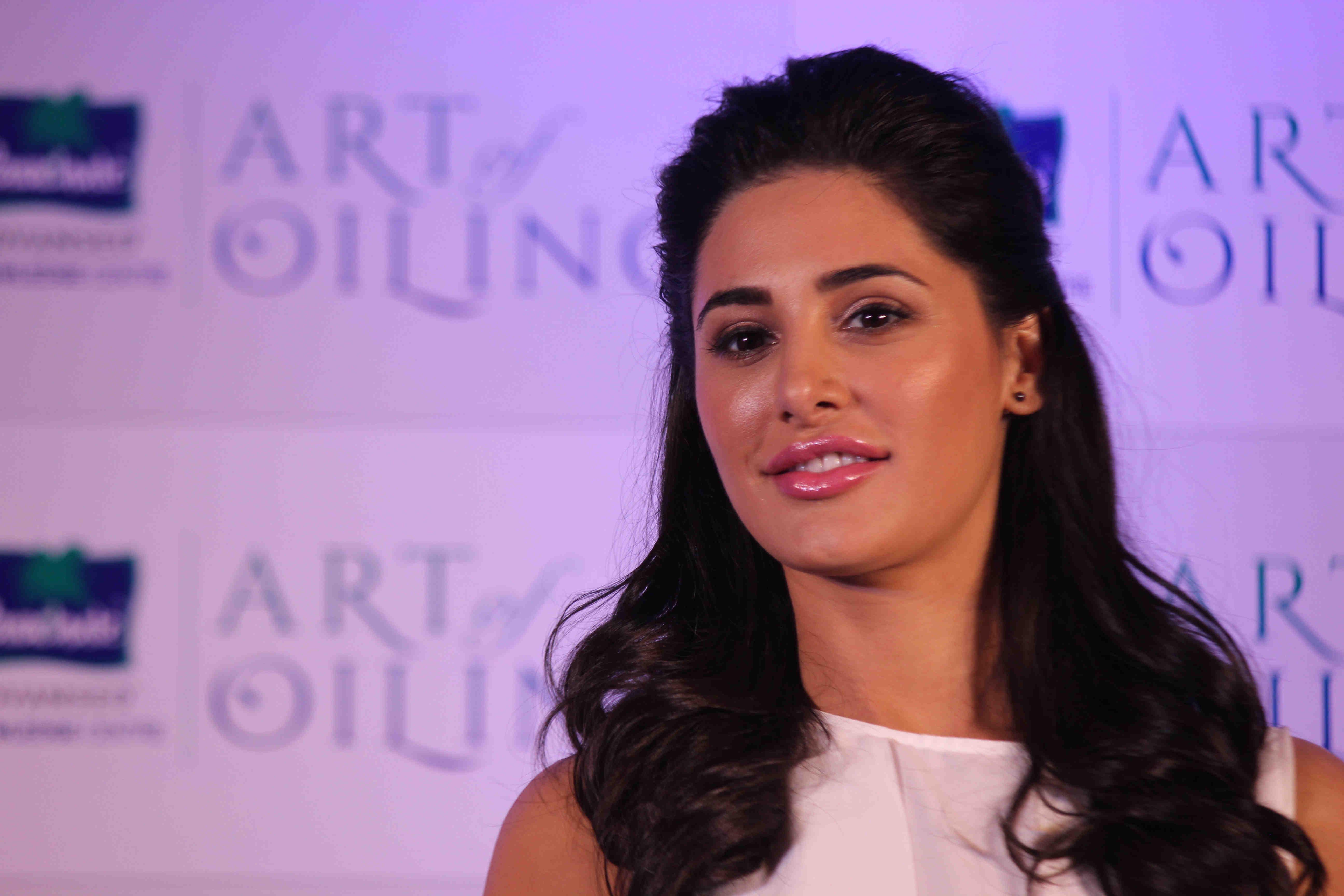 Nargis Fakhri Launch Parachute Signature Line Art Of Oiling