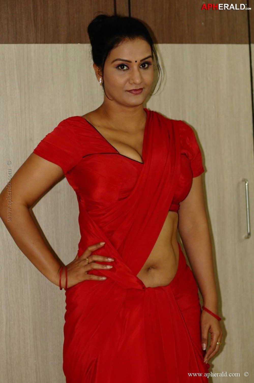 Apoorva in Red Saree Hot Photos