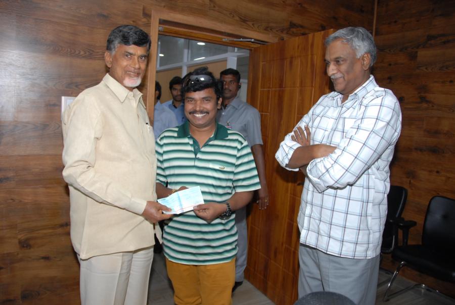 Cheque Presentation By Sampoornesh Babu To AP CM