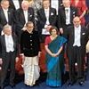 Indian American Economist with his wife seen in Indian attire during Award ceremony