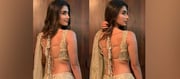 Golden Glamour: Pooja Hegde Turns Heads in Dazzling Backless Ensemble