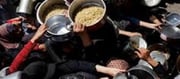 Israeli army attacks Palestinians gathered to get food in Gaza...