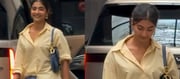 Pooja wore a bright yellow oversized shirt and blue striped pants for her outing