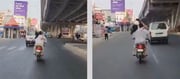 VIDEO : Woman hits husband with slipper on moving bike - Internet Reacts
