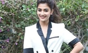 Pooja Hegde Hot Thighs Shows In White Coat Stills