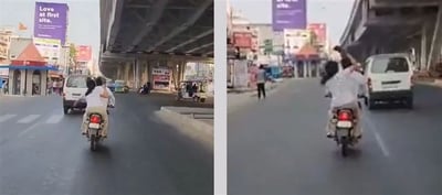 VIDEO : Woman hits husband with slipper on moving bike - Internet Reacts