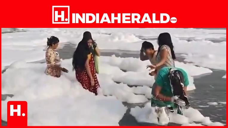 Indian Ladies Think Toxic Foam in Yamuna River as Shampoo