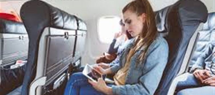 What things should you avoid wearing while traveling by flight and why?