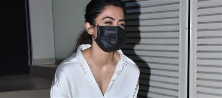 Oops Rashmika Exposes in White Satin Shirt - See Pics