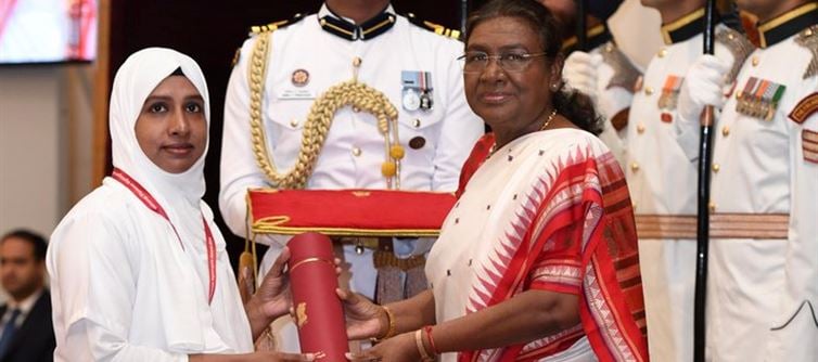 Can we shake hands with the President while receiving an award?