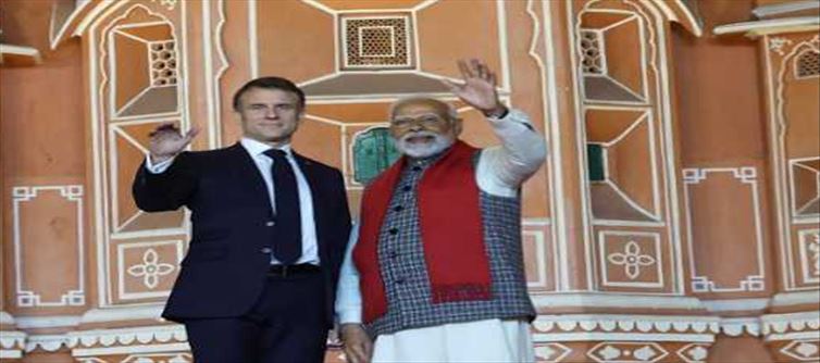 What did French President Emmanuel Macron whisper to PM Modi?