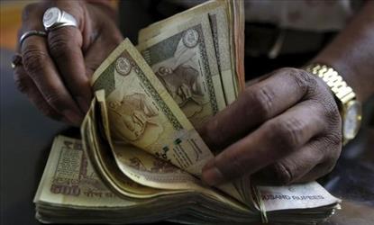 Smugglers carry Foreign Currency in small suitcases.