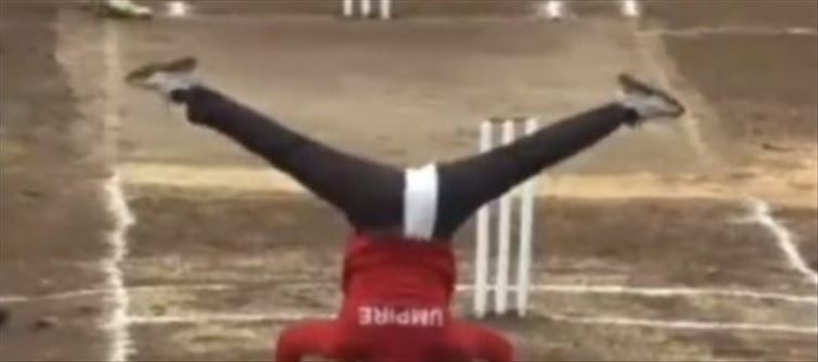 Umpire doing 'yoga' at the middle of the match ...? Viral